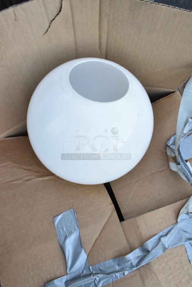 White glass light fixture shade, globe-shaped, open top, in a cardboard box. Clean condition, suitable for lamp assembly.