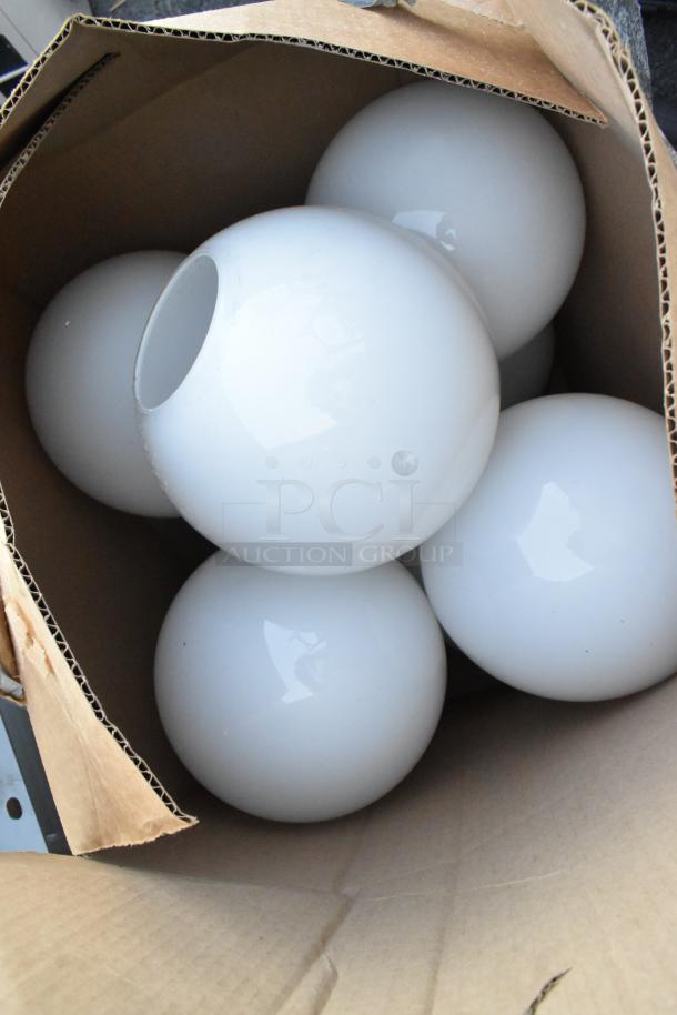 Set of 5 round white glass light fixture shades in a cardboard box, in excellent condition. Ideal for modern lighting.