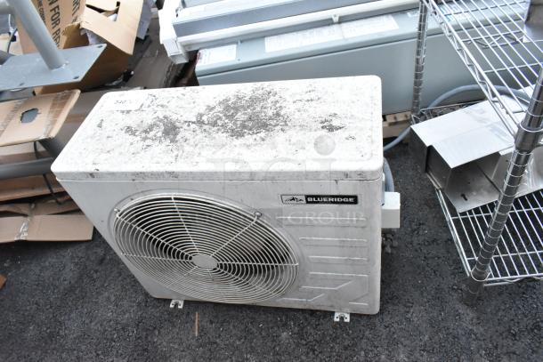 Blueridge BMKH09-D3DNC9K/O metal outdoor unit for split AC, 9,000 BTU, 208/230V, 1 Phase, weathered condition.