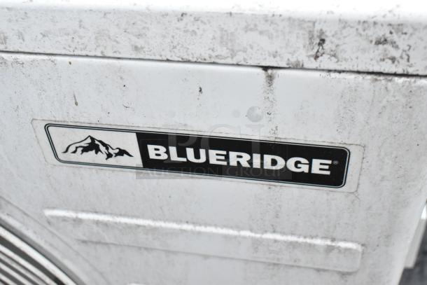 Blueridge BMKH09-D3DNC9K/O metal outdoor AC unit, 9,000 BTU, 208/230V, visible logo, some surface wear.