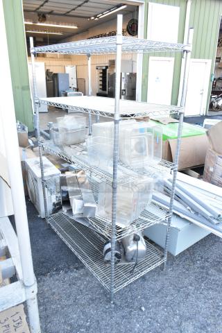 Chrome finish 5-tier wire shelving unit with poly bins and various contents. Buyer must dismantle; freight charges apply.