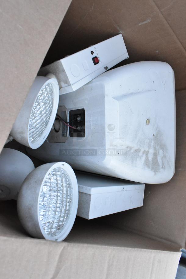 Metal 3-tier dunnage shelving unit with attached lights and speaker. Buyer must dismantle. Consider freight charges.