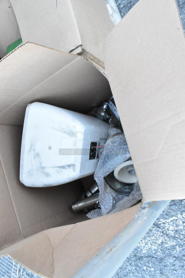 Cardboard box containing a light and other equipment, part of Metal 3 Tier Dunnage Style Shelving Unit. Buyer must dismantle.