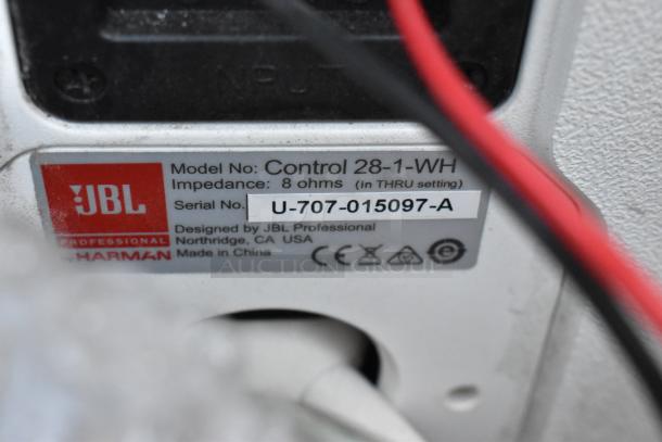 JBL Control 28-1-WH speaker label showing model, impedance, serial number, and manufacturing details.