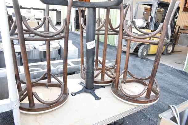 Five assorted items, including two tables and three wooden stools, upside down on a flat surface. Number label "343" visible.