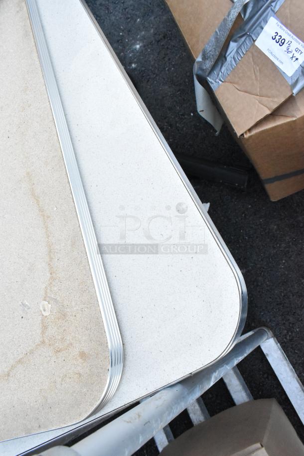 5 items including 2 vintage metal-edged tables and 3 stools. Tables show signs of wear. Auction label visible on box.