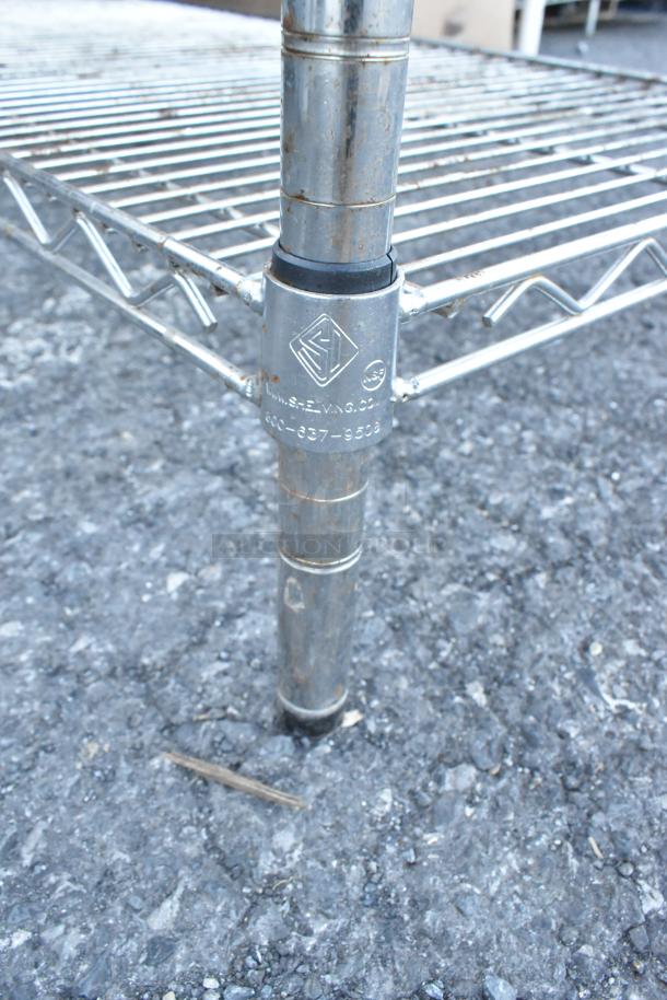 Chrome finish 4-tier wire shelving unit, visible brand marking SE-VNG. Buyer required to dismantle. Labels indicate freight considerations.