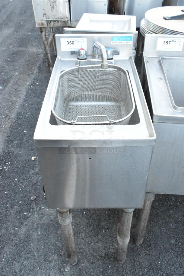 BK Resources BKUBS-1014HSS12 stainless steel single bay sink with faucet and handles, in used condition with visible tags.