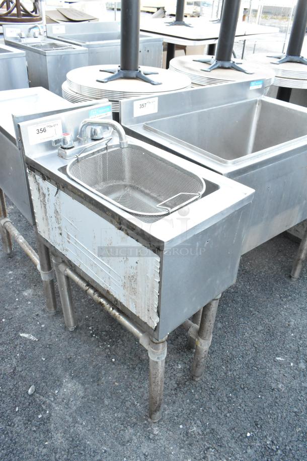 BK Resources BKUBS-1014HSS12 stainless steel single bay sink with dual handles and faucet, visible wear marks, industrial setting.