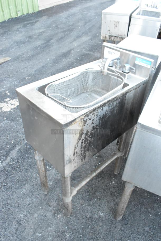 BK Resources BKUBS-1014HSS12 stainless steel single bay sink with faucet, handles, and visible wear on the exterior.