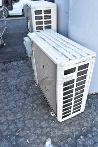Gree MULTI24HP230V1CO outdoor AC unit, 24,000 BTU, 208/230V, visible wear on metal case, functional condition.