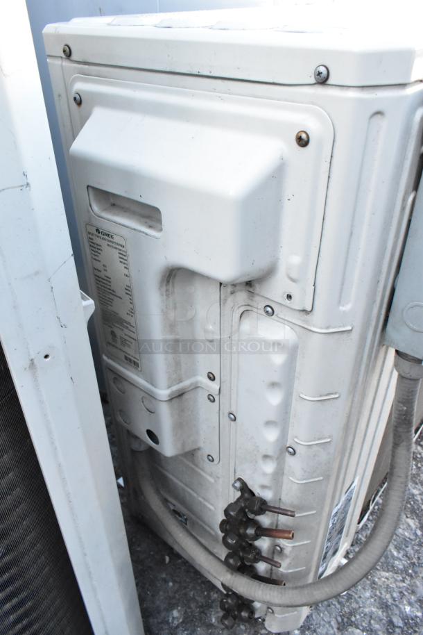 Gree MULTI24HP230V1CO outdoor unit for split AC, 24,000 BTU, model label visible, some wear, 208/230V, 1 phase.