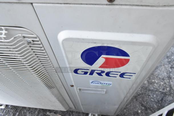 Gree MULTI24HP230V1CO outdoor unit, metal, 24,000 BTU, 208/230V, 1 phase, inverter label, visible wear, good condition.