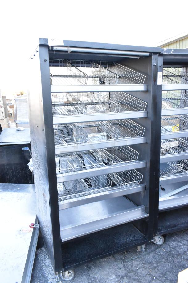 Vulcan 1013776 metal bakery display rack with wire shelves, in used condition, features commercial casters for mobility.