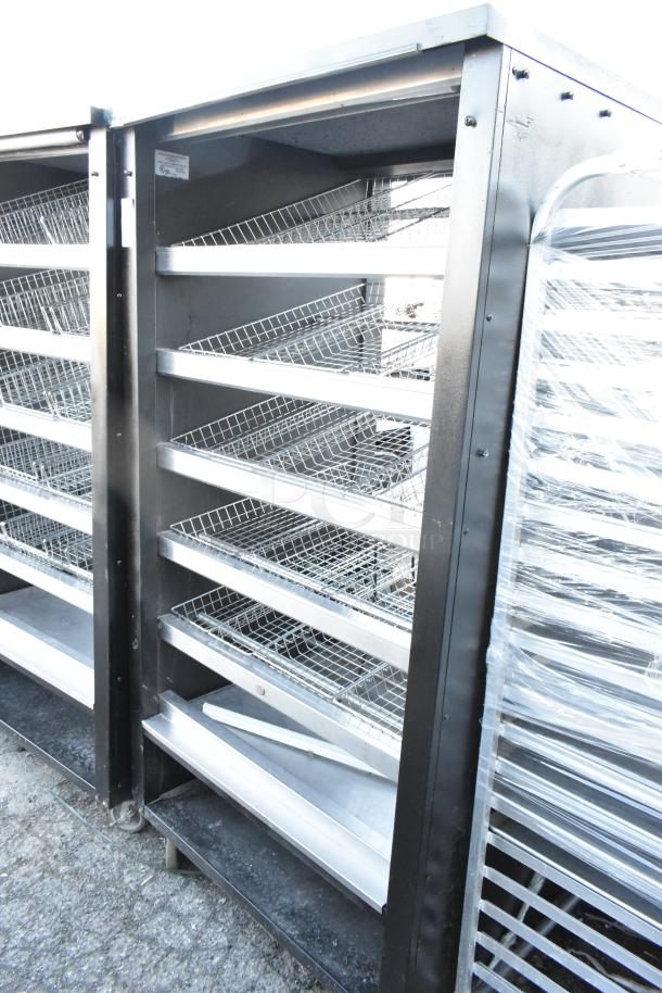 Vulcan 1013776 metal bakery donut display rack with commercial casters, 6 angled wire shelves, durable condition.