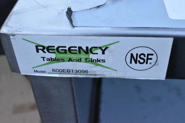 BRAND NEW Scratch and Dent Regency 600EBT3096 stainless steel table, 30"x96", type 304, enclosed base, open front, adjustable midshelf.
