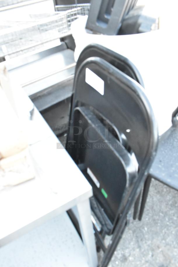 Lot of mixed items including white poly trash cans, black poly chairs, and black metal folding chairs.