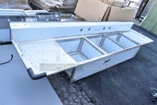 Brand new Regency stainless steel 3 bay sink with dual drain boards, scratch and dent condition, no legs.