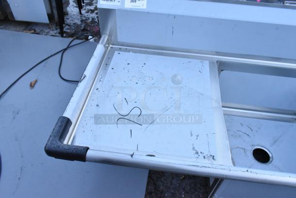 Regency 3-bay stainless steel sink with dual drain boards, brand new scratch and dent, no legs, visible scuffs and markings.