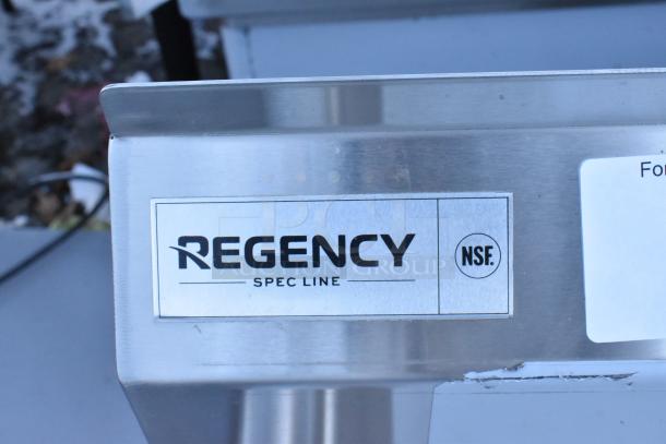 Regency stainless steel 3 bay sink label. Features dual drain boards. Brand new with visible scratches and dents. No legs. NSF certified.