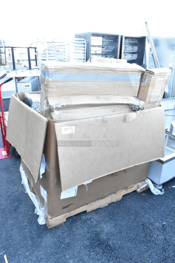 Large shipping box containing 18 brand new items including a work table and cutting boards, labeled as scratch and dent.