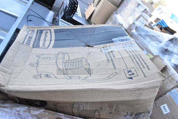 Cardboard box containing a Rubbermaid WaveBrake mop bucket, slightly damaged, part of a scratch and dent auction set.