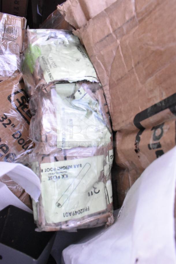 Cardboard boxes with various items inside, labeled with part numbers and packaging details. Signs of wear visible.