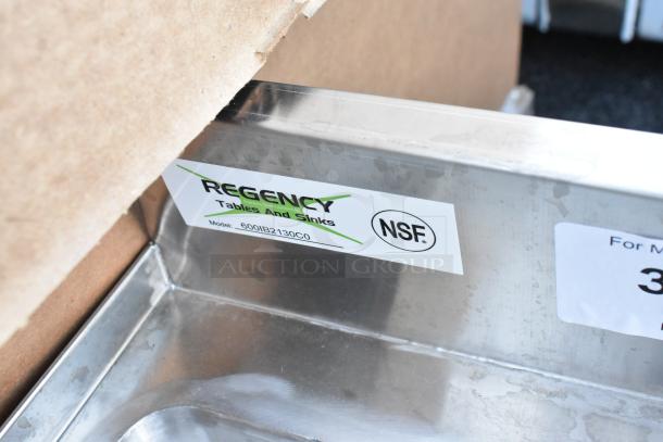 "Brand new Regency 600IB2130C0 underbar ice bin, 21x30 inches, with 10 circuit post-mix cold plate. Visible NSF label."