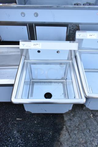 Steelton 522CS11818N stainless steel single bay sink, brand new scratch and dent, no legs, visible label with item info.