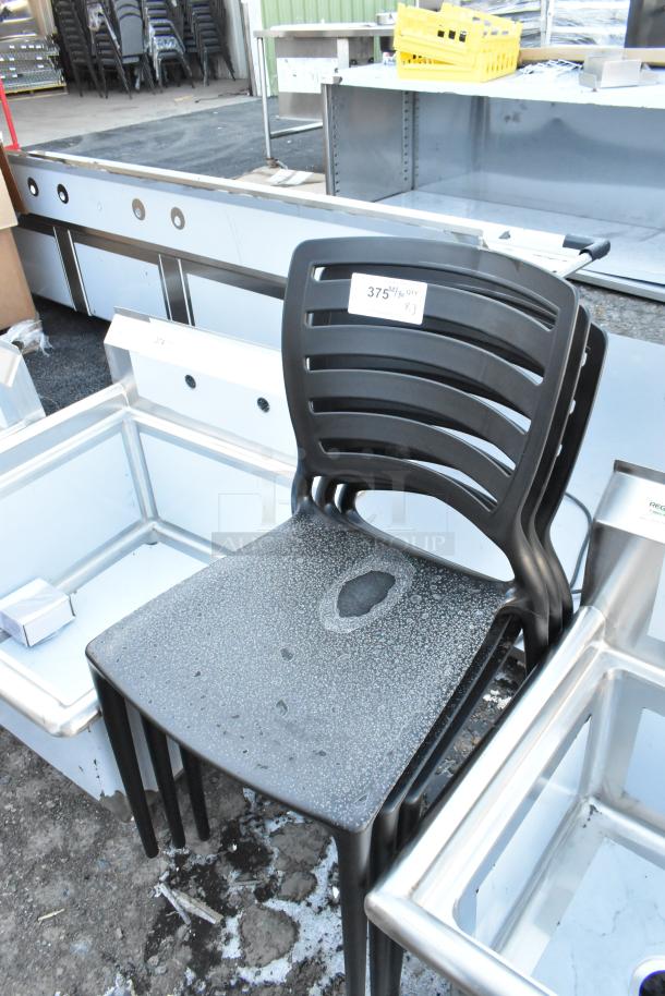 Three new black poly chairs with minor scratches and dents. Stackable design, labeled "375 1/3 QTY X3."