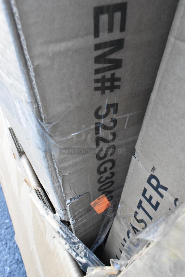 Brown cardboard box with visible markings, includes 10 scratch and dent items like equipment stand, trash can lid.