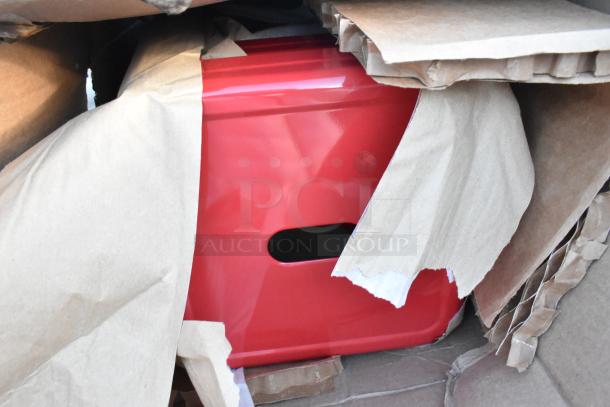 Red metallic item partially unwrapped in shipping materials, representing 1 of 6 new scratch and dent auction items.