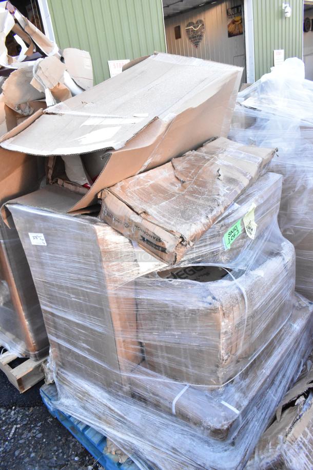 Pallet with 6 new scratch and dent items including a dump sink and red stools in damaged packaging.