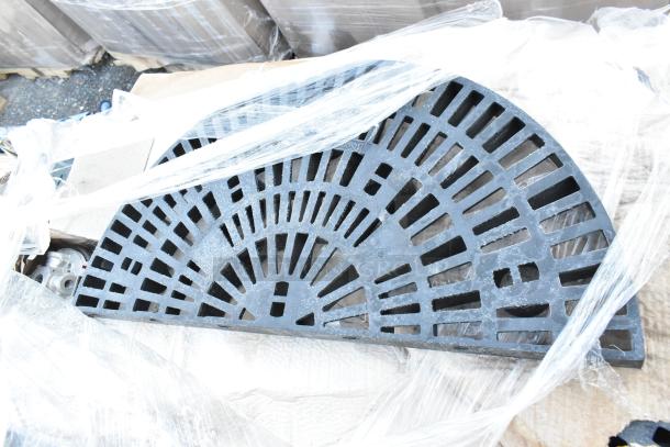 Five brand new black poly shelf pieces, with minor scratches and dents, wrapped in protective plastic.