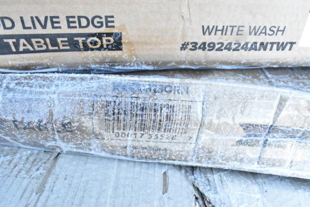 Cardboard boxes labeled "LIVE EDGE," "WHITE WASH," and "#3492424ANTWT" for scratch and dent table items.