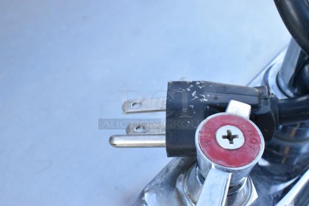 QualServ stainless steel portable sink plug and hot tap detail. Commercial casters, 120V, 1 phase. Visible wear on plug.