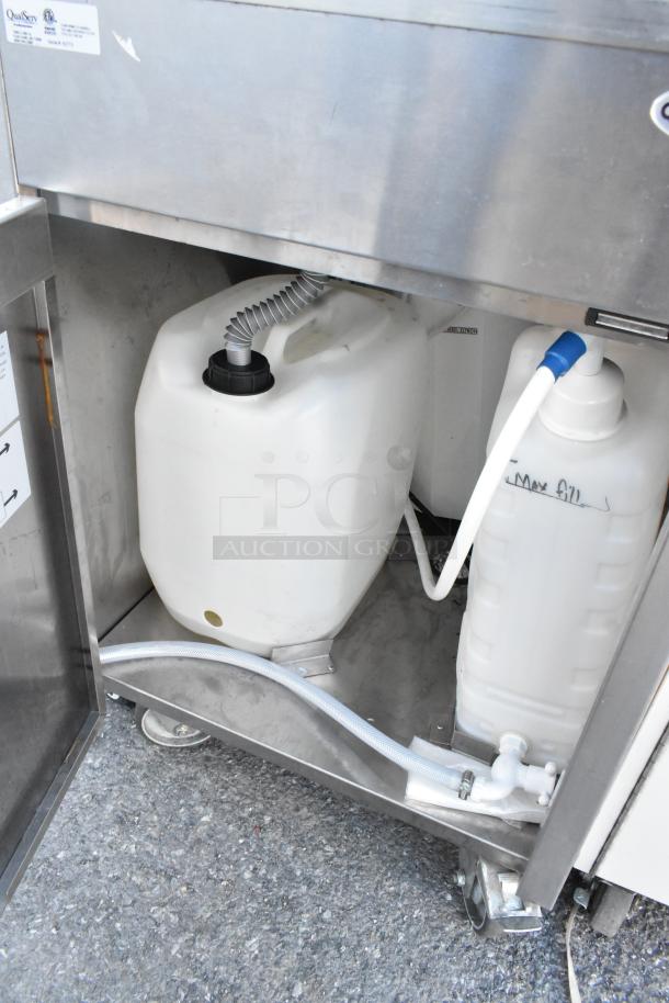 QualServ stainless steel portable sink on commercial casters, 120 volts, 1 phase; features interior tanks and hoses.