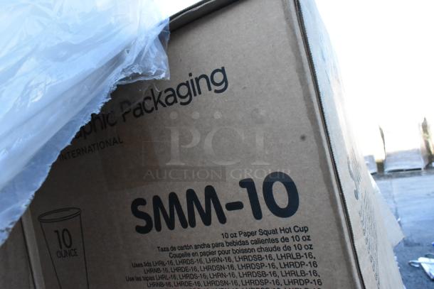 Cardboard box labeled "SMM-10" with details for 10 oz paper squat hot cups. Contains brand new scratch and dent items.