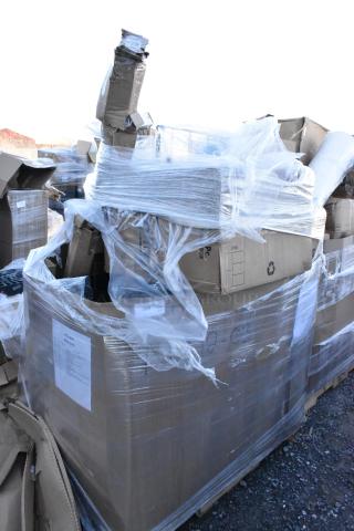 Large pallet of 15 scratch and dent items including boxes of paper towels and containers wrapped in plastic.