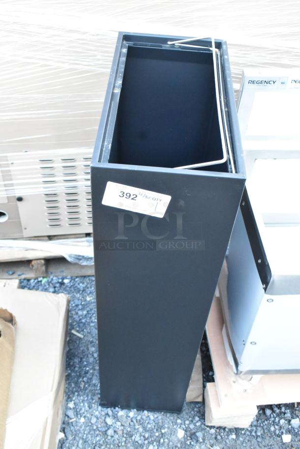 Brand new Lancaster Table & Seating black trash can, scratch and dent condition, with a visible quantity label "392 QTY 1".