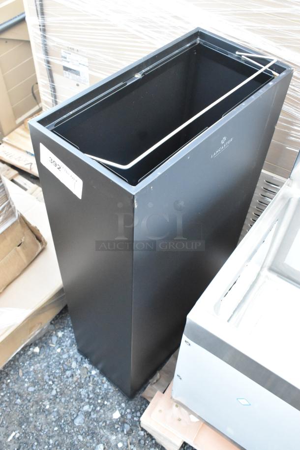 Brand new Lancaster Table & Seating black trash can, with minor scratches and dents, featuring a sleek design.