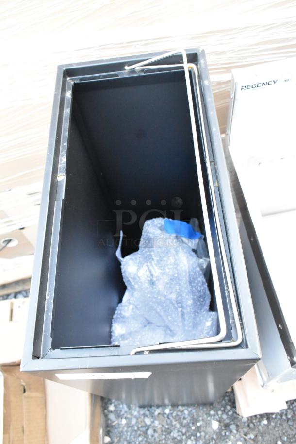 Lancaster Table & Seating black trash can, brand new, visible scratch and dent, bubble wrap inside.