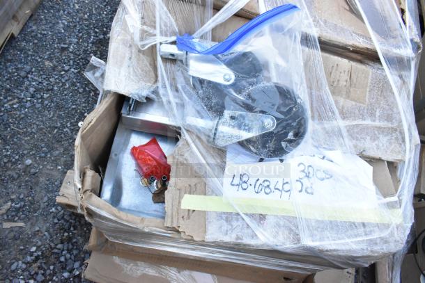 Box of assorted new items, including casters and hardware, labeled "48.68.46," showing scratch and dent condition.