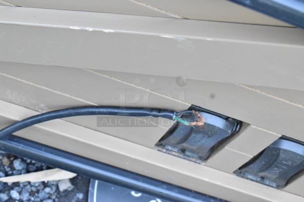 Electrical plug and frayed wire on the Killion PFW-74-43-48-V-N-MOBILE Grab N Go Merchandiser.