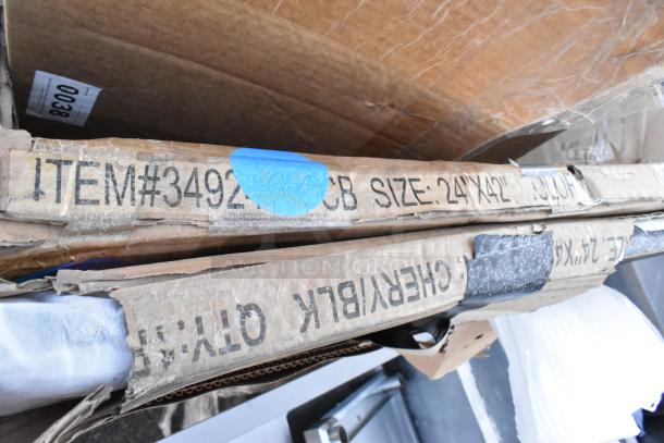 Nine brand new scratch and dent items including equipment filler table tabletop. Box labeled ITEM#3492, size 24"x42".