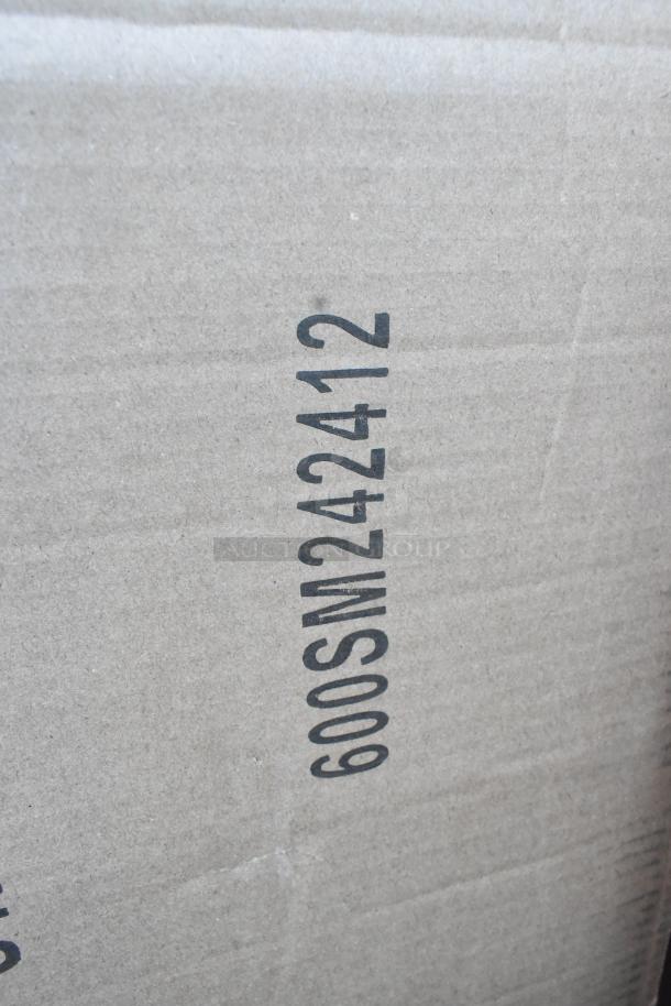 Cardboard box with visible marking "600SM242412," indicating a scratch and dent auction item. Includes wire shelves, folding chair, storage bin.