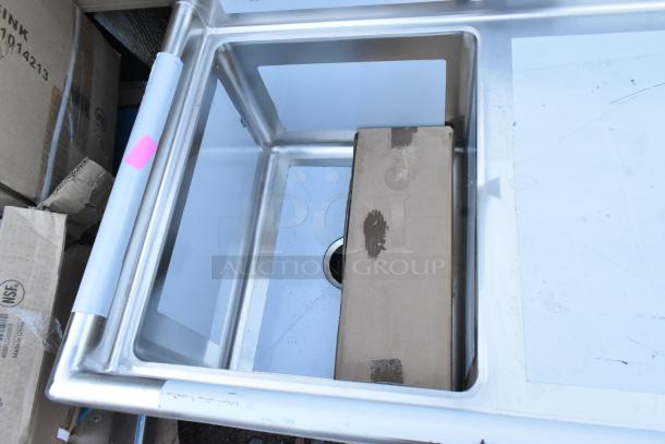 Brand new Regency 600S1162018R stainless steel single bay sink with right side drain board, visible scratch and dent.