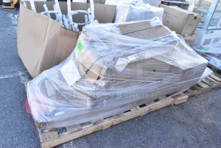 Pallet with 5 new scratch and dent items including wall shelves and trash liner, shrink-wrapped and labeled for auction.