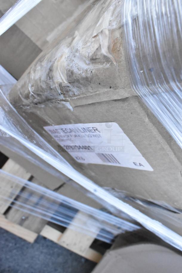 Pallet with boxed items wrapped in plastic; label reads "Waste Can Liner," indicating contents. Scratch and dent condition.