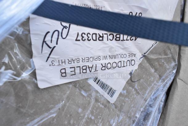 Label indicating outdoor table, part of a lot of 5 brand new scratch and dent items, including wall shelves and trash liner.